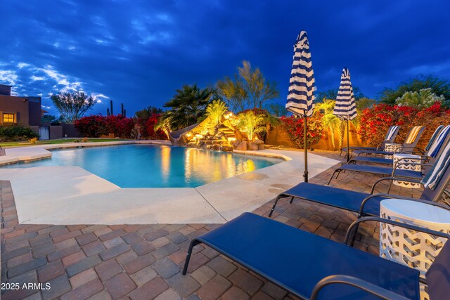 view of swimming pool featuring a patio area