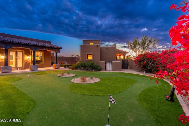 view of yard at dusk