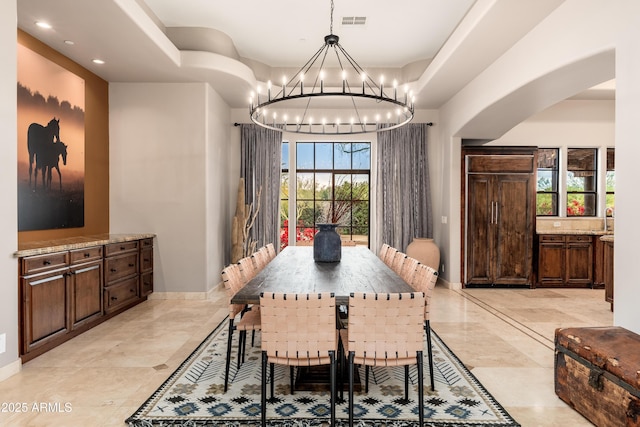 dining room featuring a chandelier