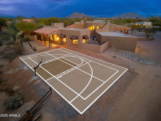 view of basketball court with a mountain view