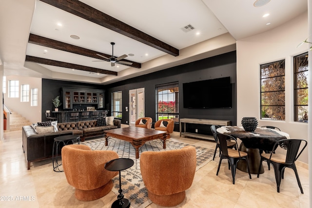 living room with beam ceiling and ceiling fan