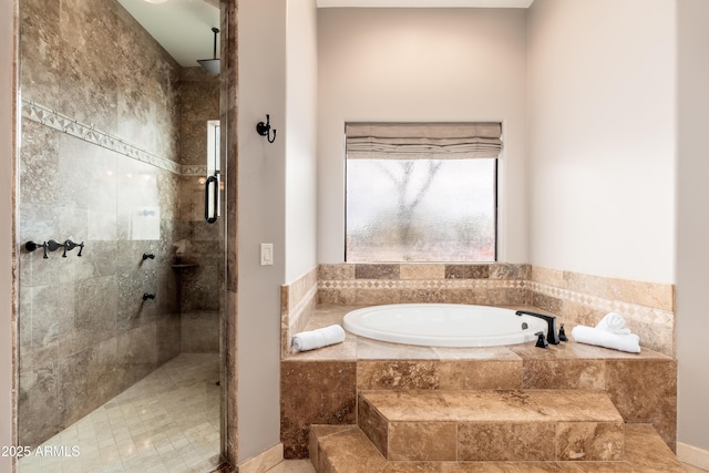 bathroom featuring separate shower and tub