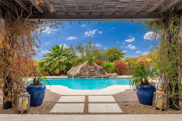 view of swimming pool with a patio, a water slide, and a pergola