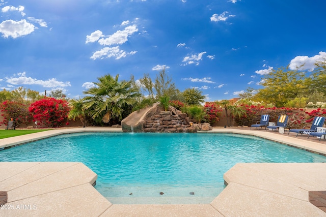 view of swimming pool featuring a water slide and a patio area