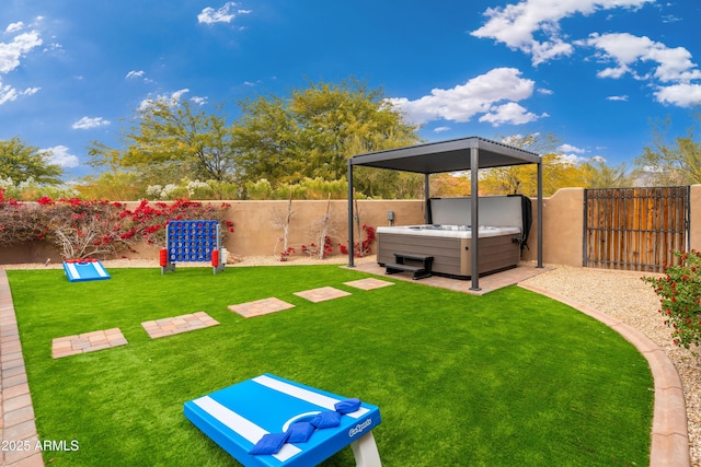 view of yard featuring a hot tub