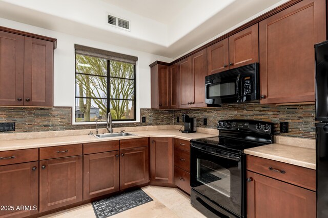 kitchen with sink, backsplash, black appliances, and light tile patterned flooring