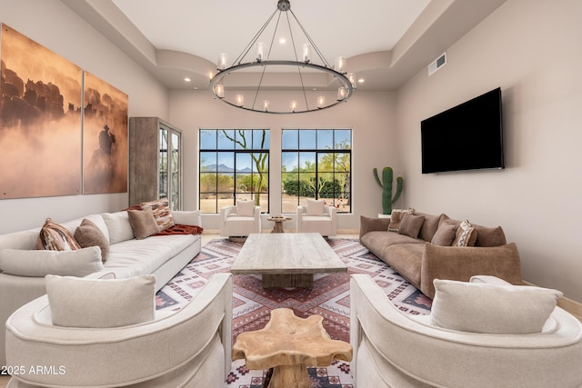 living room featuring a notable chandelier