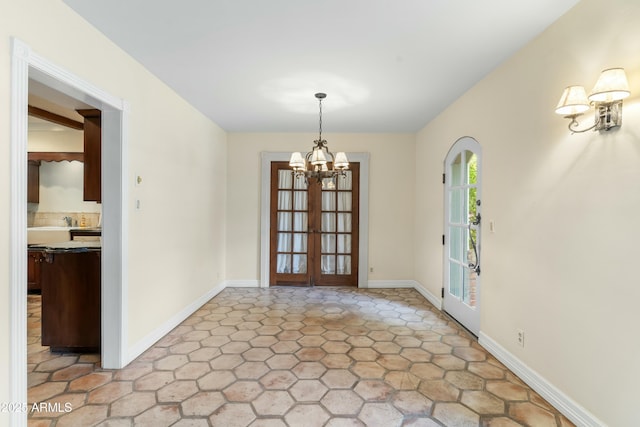 unfurnished dining area featuring a notable chandelier