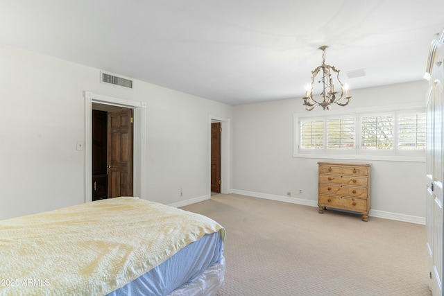 carpeted bedroom with a chandelier