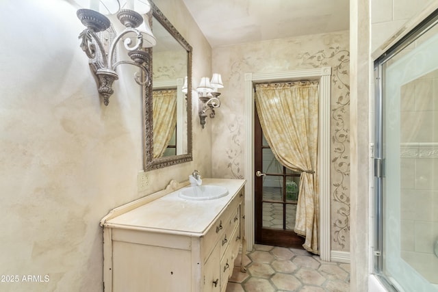 bathroom with vanity, tile patterned floors, and bath / shower combo with glass door