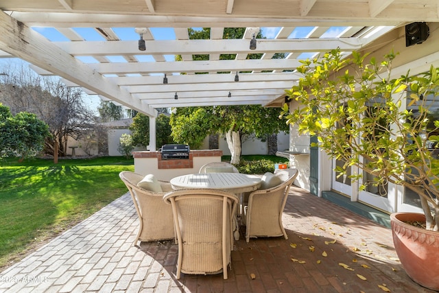 view of patio / terrace with a pergola, grilling area, and exterior kitchen