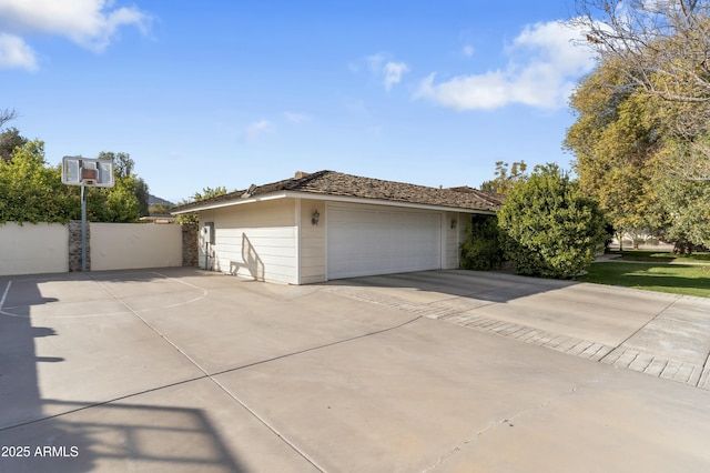 view of side of home with a garage