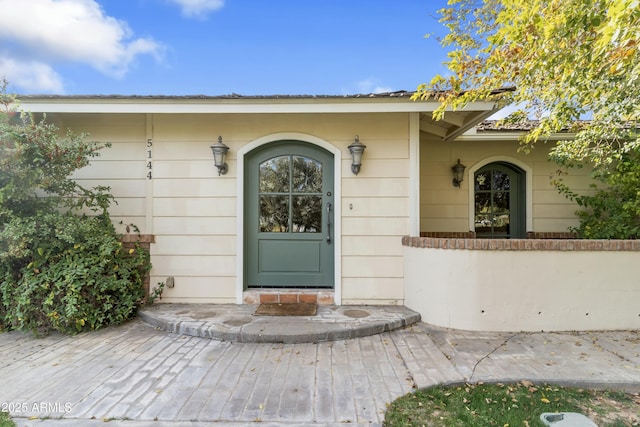 entrance to property with a patio area