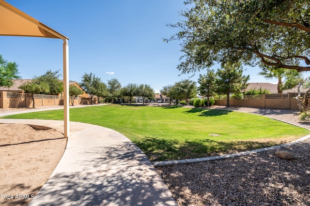 view of property's community with a yard