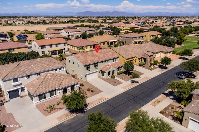 birds eye view of property with a mountain view