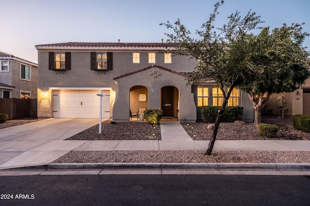 mediterranean / spanish-style house featuring a garage