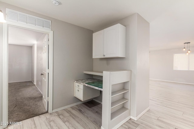 bathroom with wood finished floors, visible vents, and baseboards