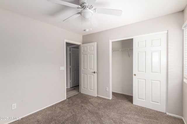 unfurnished bedroom featuring carpet, ceiling fan, and a closet