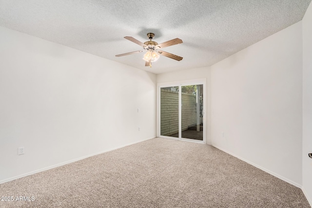 spare room with ceiling fan, carpet floors, and a textured ceiling