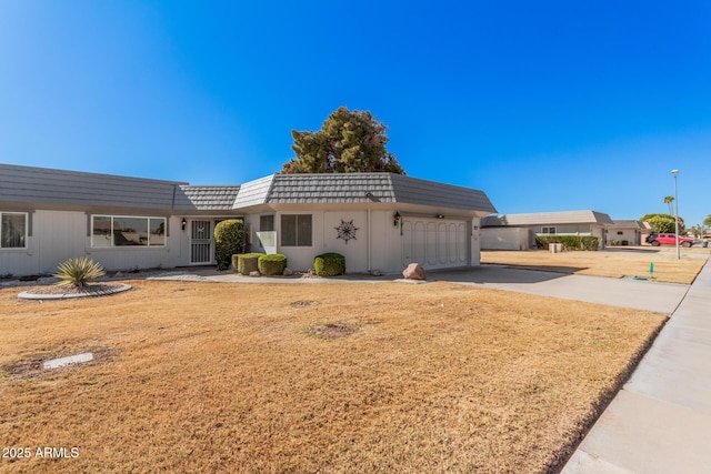 ranch-style house featuring a garage