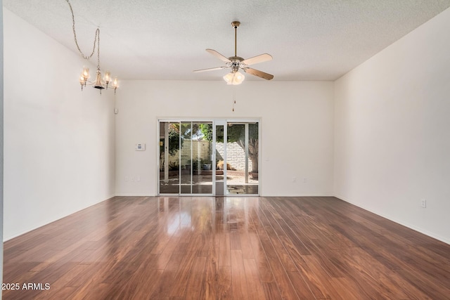 unfurnished room with hardwood / wood-style flooring, ceiling fan with notable chandelier, and a textured ceiling