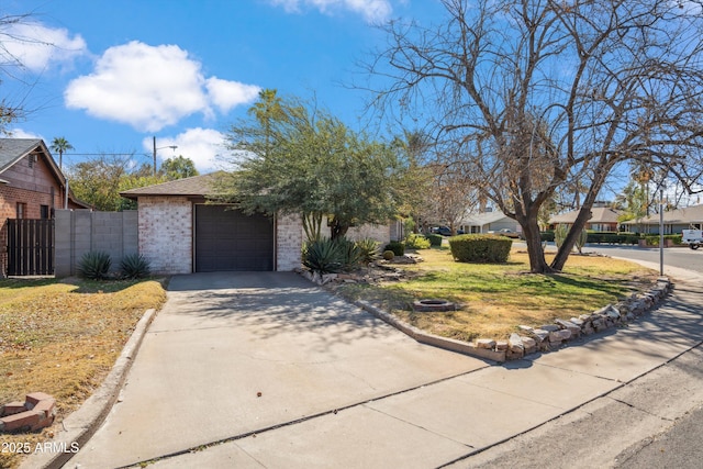 view of front facade with a garage and a front lawn