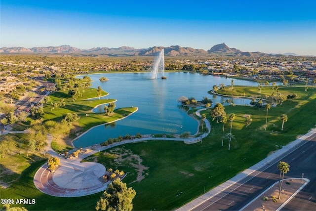 drone / aerial view featuring a water and mountain view