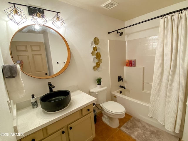 bathroom with visible vents, toilet, tile patterned floors, shower / bath combo with shower curtain, and vanity