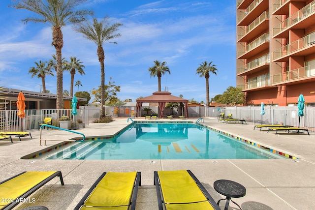 view of swimming pool featuring a gazebo and a patio area