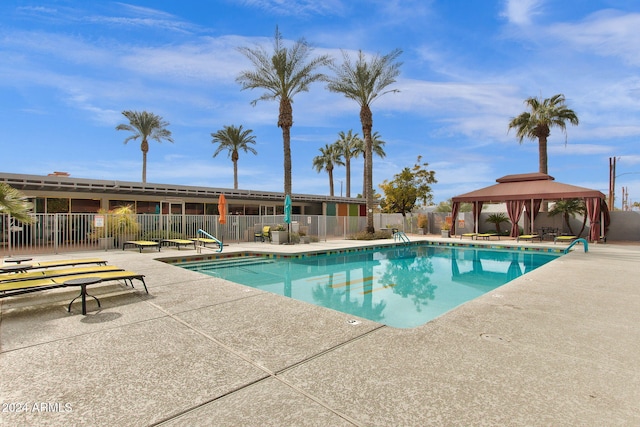 view of swimming pool featuring a gazebo and a patio area