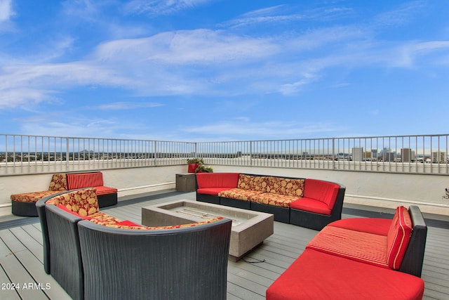 wooden terrace featuring a water view and an outdoor hangout area