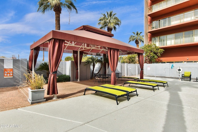 view of property's community featuring a gazebo and a patio area