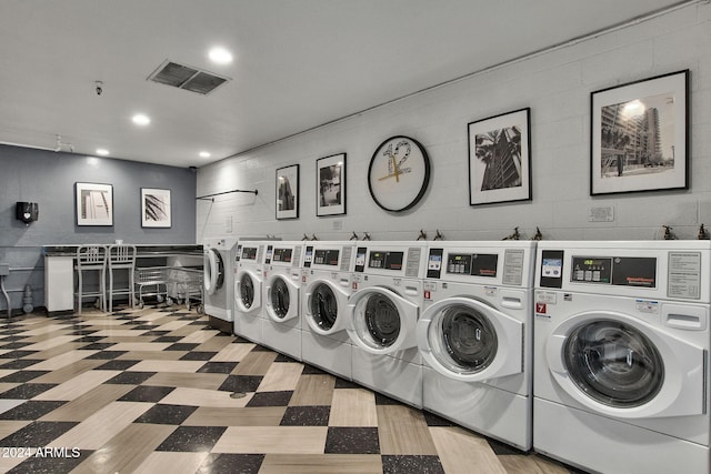 washroom featuring washer and dryer