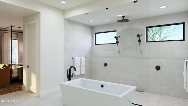 bathroom with recessed lighting, a soaking tub, baseboards, and a walk in shower