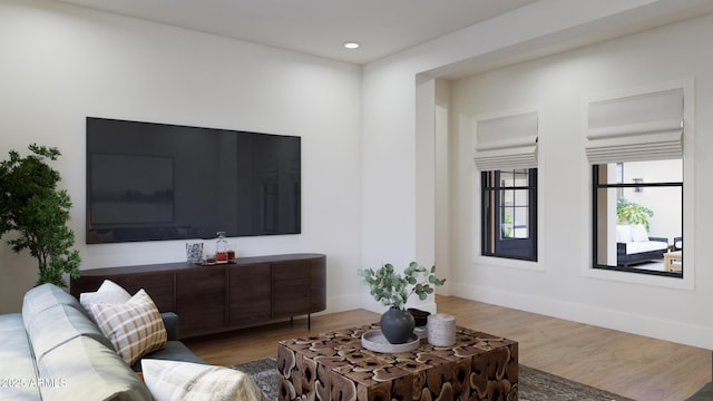 living room featuring recessed lighting, baseboards, and wood finished floors