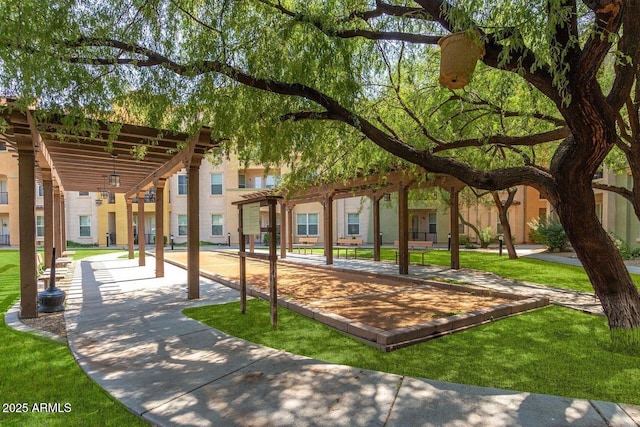 view of home's community featuring a residential view, a lawn, and a pergola