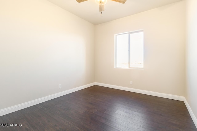 spare room featuring ceiling fan and dark hardwood / wood-style flooring