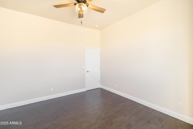 empty room with dark wood-type flooring and ceiling fan