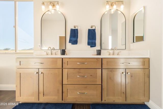 bathroom with vanity and hardwood / wood-style floors