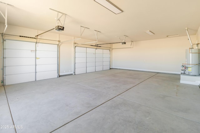 garage featuring water heater and a garage door opener