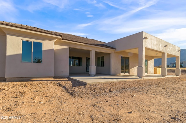 back of property with a patio area