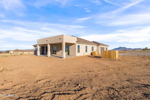 rear view of house with a mountain view