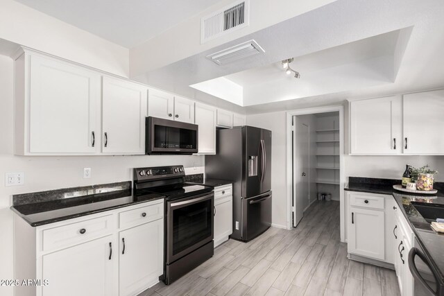 19031 N 13th Dr, Phoenix, AZ 85027 - kitchen with stainless steel electric stove, refrigerator with ice dispenser, dishwasher, white cabinets, and a tray ceiling