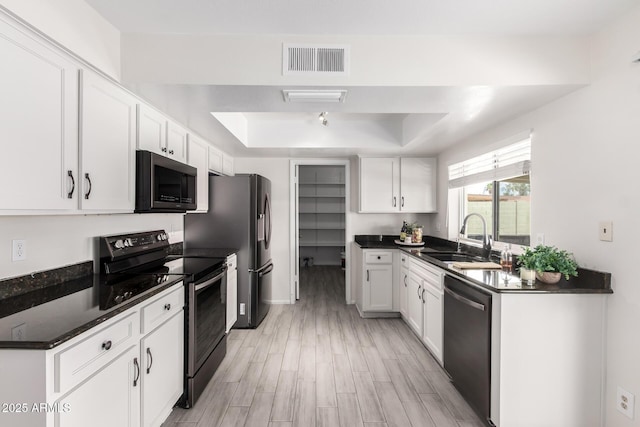 19031 N 13th Dr, Phoenix, AZ 85027 - kitchen with electric range, stainless steel dishwasher, a sink, a tray ceiling, and dark countertops