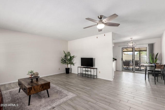 19031 N 13th Dr, Phoenix, AZ 85027 - living room with wood finished floors, a ceiling fan, and baseboards