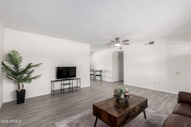 19031 N 13th Dr, Phoenix, AZ 85027 - living area with wood finished floors, ceiling fan, and baseboards