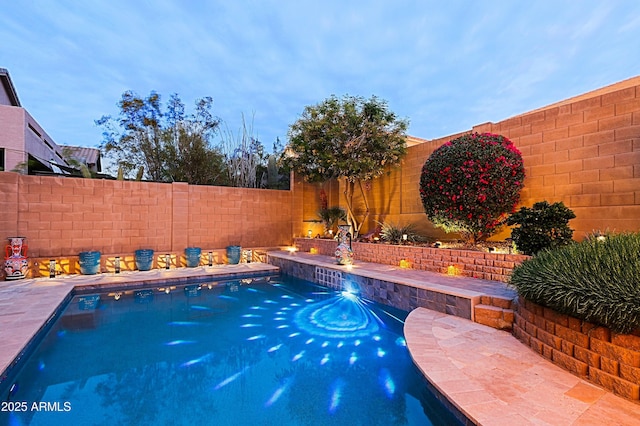view of pool with a fenced backyard and a fenced in pool