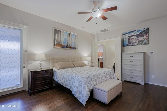 bedroom with a ceiling fan, dark wood-style floors, baseboards, and visible vents