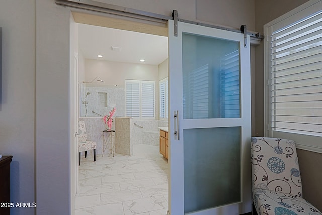 bathroom featuring vanity, marble finish floor, visible vents, and walk in shower