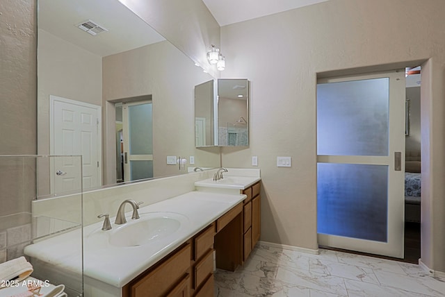 full bathroom featuring marble finish floor, visible vents, a sink, and double vanity